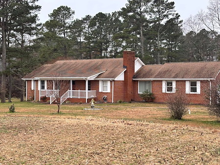 What’s the Safest Way to Remove Black Streaks and Algae From Your Roof?